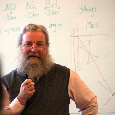 David J. Helfand teaching in front of a classroom.